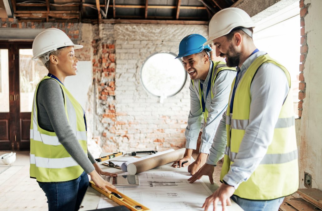 Construction Execs Looking Over BluePrints
